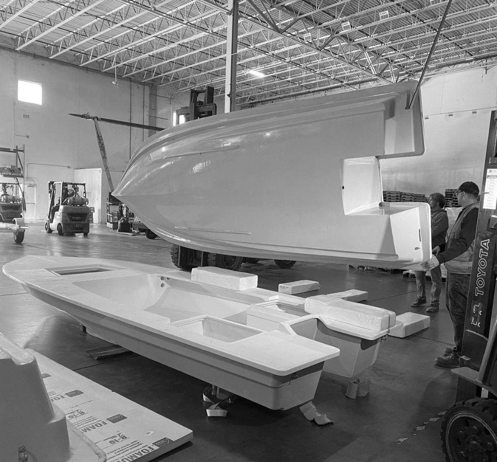 Lancha 18 hull and deck being assembled in the shop