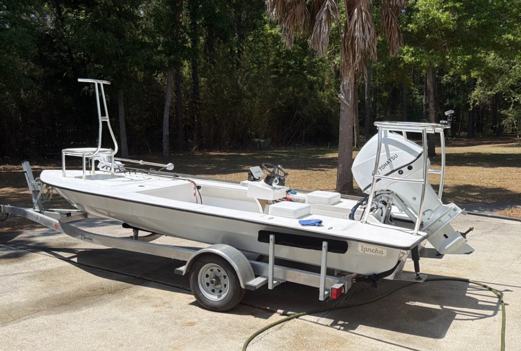 Lancha 18 skiff rigged on a trailer from the side
